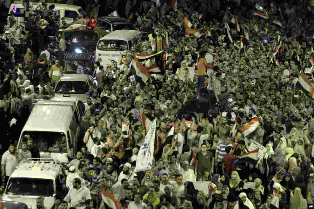 Supporters of Egypt's ousted President Mohamed Morsi block Giza square during a march near Cairo University, where protesters have been camped out, Cairo, July 15, 2013.