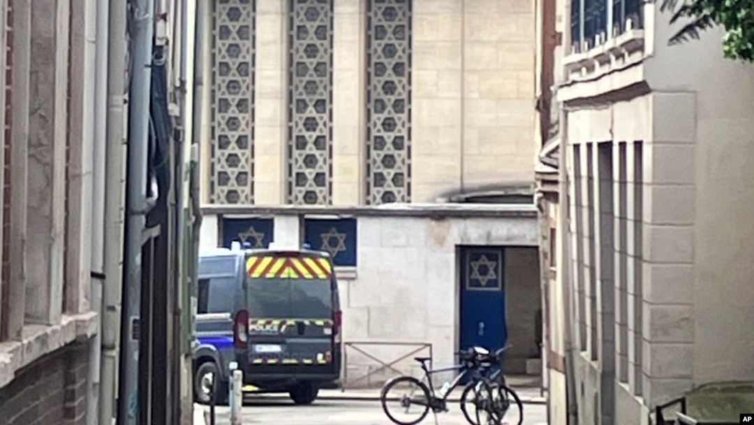 A police car is parked in front of the synagogue in Rouen, France, May 17, 2024. 