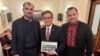 Serhii Gadarzhi, left, who lost his wife and son in a drone strike in Odesa, Ukraine, with U.S. House Speaker Mike Johnson, center, and Pavlo Unguryan, a former Ukraine member of parliament. 