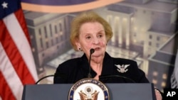 FILE - Former U.S. Secretary of State Madeleine Albright speaks at a reception celebrating the completion of the U.S. Diplomacy Center Pavilion at the State Department in Washington, Jan. 10, 2017. 
