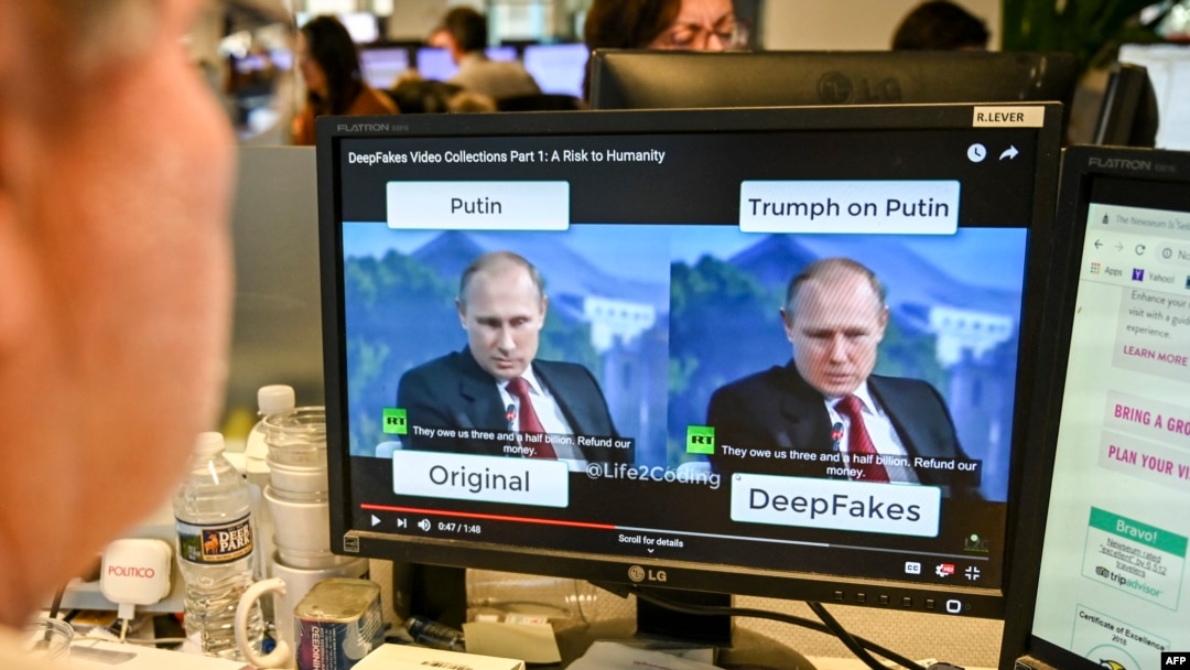 FILE - An AFP journalist watches a video manipulated with artificial intelligence to potentially deceive viewers, or "deepfake," at his desk in Washington, D.C., Jan. 25, 2019.