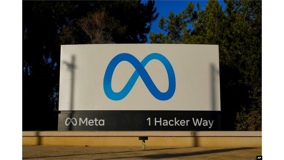 FILE - Meta's logo can be seen on a sign at the company's headquarters in Menlo Park, California, on Nov. 9, 2022.