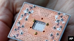 Photo shows a seven cubit quantum device is seen at the IBM Thomas J. Watson Research Center in Yorktown Heights, N.Y. 
