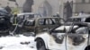 Firemen work at the site where a car exploded near a Shi'ite mosque in Dammam, Saudi Arabia, May 29, 2015. 