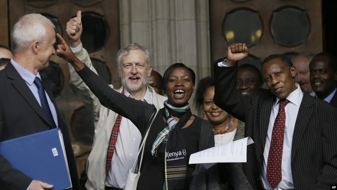 Supporters cheer outside the Royal Courts of Justice in London following a verdict in the Mau Mau torture compensation claim case, October 5, 2012.