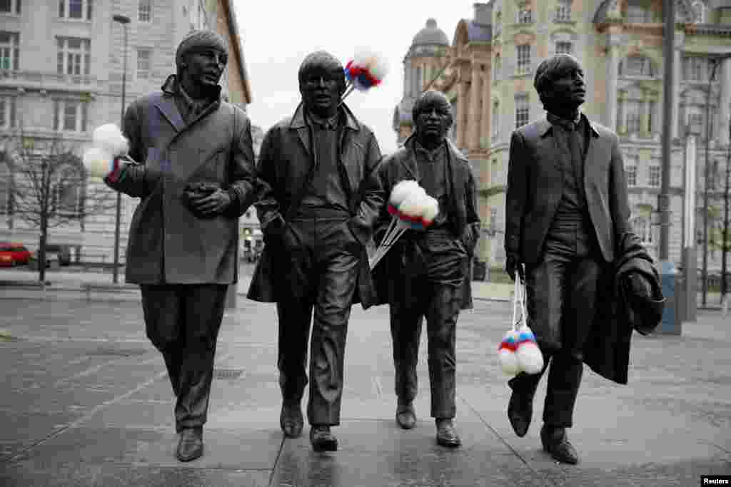 A statue of The Beatles sports &quot;tickling sticks&quot;, comedian Ken Dodd&#39;s quintessential prop, ahead of Dodd&#39;s funeral in his home town of Liverpool, Britain.
