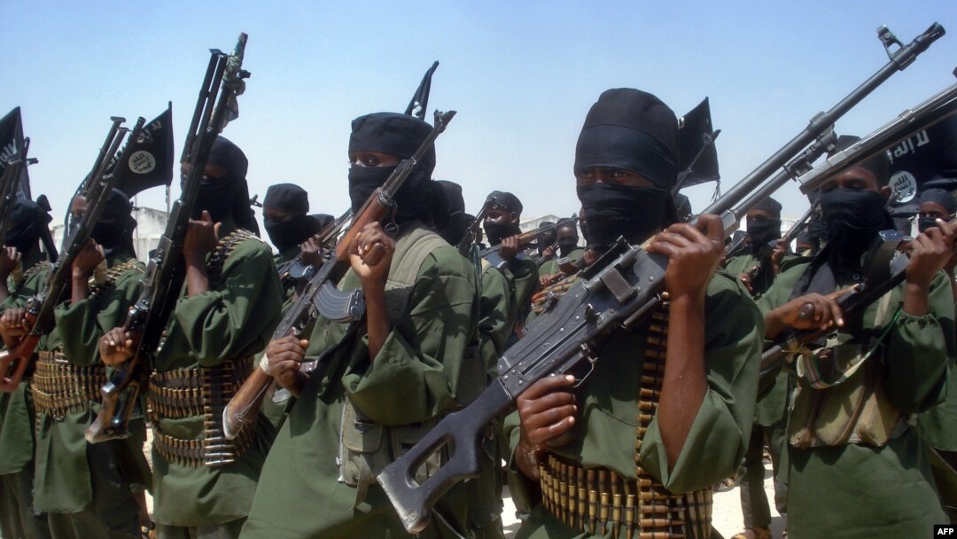FILE - Islamist fighters loyal to al-Shabab perform military drills at a village in the Lower Shabelle region, 25 kilometers outside Mogadishu, Feb. 17, 2011. 