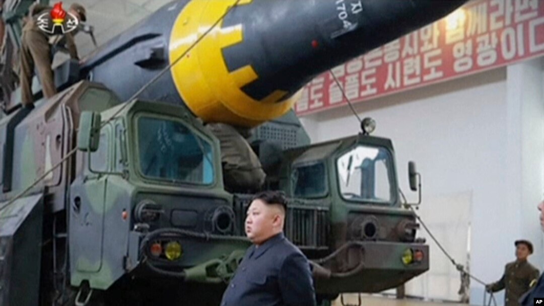 FILE - This image made from video of an undated image broadcast by North Korea's KRT, May 15, 2017, shows leader Kim Jong Un at what was said to be a missile test site at an undisclosed location in North Korea. 