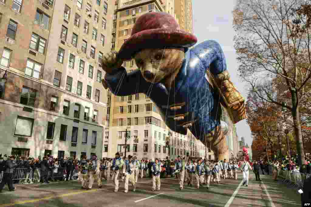 The Paddington Bear balloon floats down Central Park West during the 90th annual Macy's Thanksgiving Day Parade in New York.