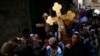 Christian worshippers hold crosses as they take part in a procession along Via Dolorosa on Good Friday during Holy Week in Jerusalem's Old City April 18, 2014. Christian worshippers on Friday retraced the route Jesus took along Via Dolorosa to his crucifi