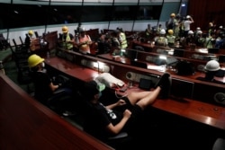 Anti-extradition bill protesters are seen inside a chamber after they broke into the Legislative Council building during the anniversary of Hong Kong's handover to China in Hong Kong, July 1, 2019.