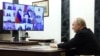 FILE - In this photograph distributed by the Russian state agency Sputnik, President Vladimir Putin holds a meeting on measures taken after the massacre in the Crocus City Hall. In the aftermath of the attack, Putin tried to tie the gunmen to Ukraine, which Kyiv flatly denied.