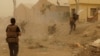FILE - Iraqi security forces defend their headquarters against attacks by Islamic State extremists in the eastern part of Ramadi in Anbar province, May 14, 2015. 