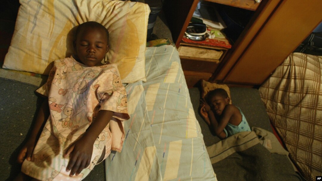 FILE - Children take an afternoon nap at an orphanage in Harare, Zimbabwe, May 26, 2006. One of the biggest problems caused by AIDS in Africa is the number of children who are being orphaned as the disease kills their parents and guardians.