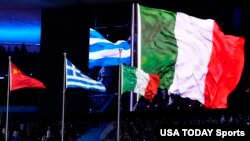 The flags of the People’s Republic of China and Greece and Italy are displayed during the closing ceremony for the Beijing 2022 Olympic Winter Games at Beijing National Stadium, Feb 20, 2022.