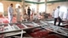 Family members of victims and well wishers are seen after a suicide bomb attack at the Imam Ali mosque in the village of al-Qadeeh in the eastern province of Gatif, Saudi Arabia, May 22, 2015.